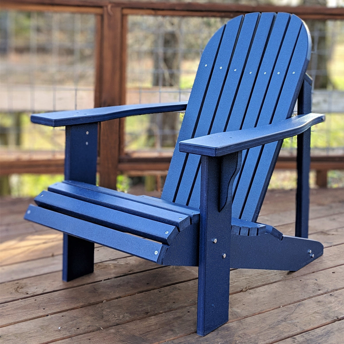 Blue Adirondack chair on a wooden deck