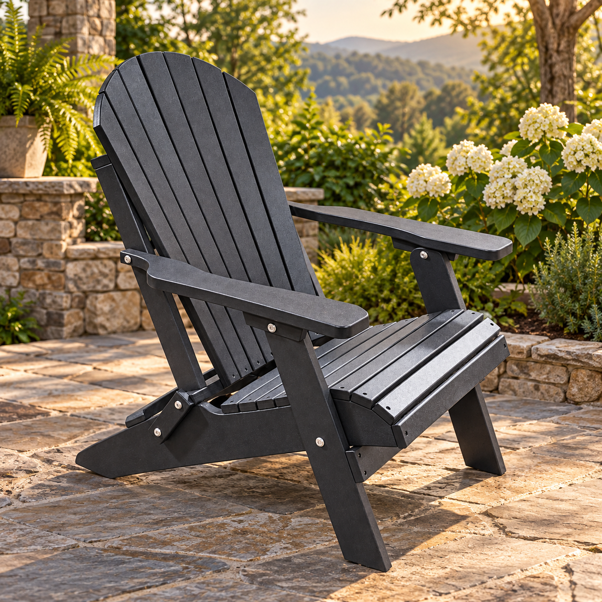 Evergreen Patio black Adirondack chair on a stone garden patio